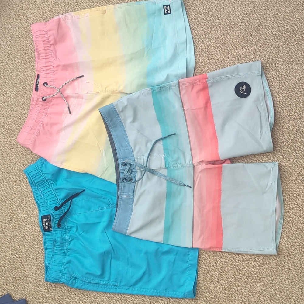 Three pair boys board shorts